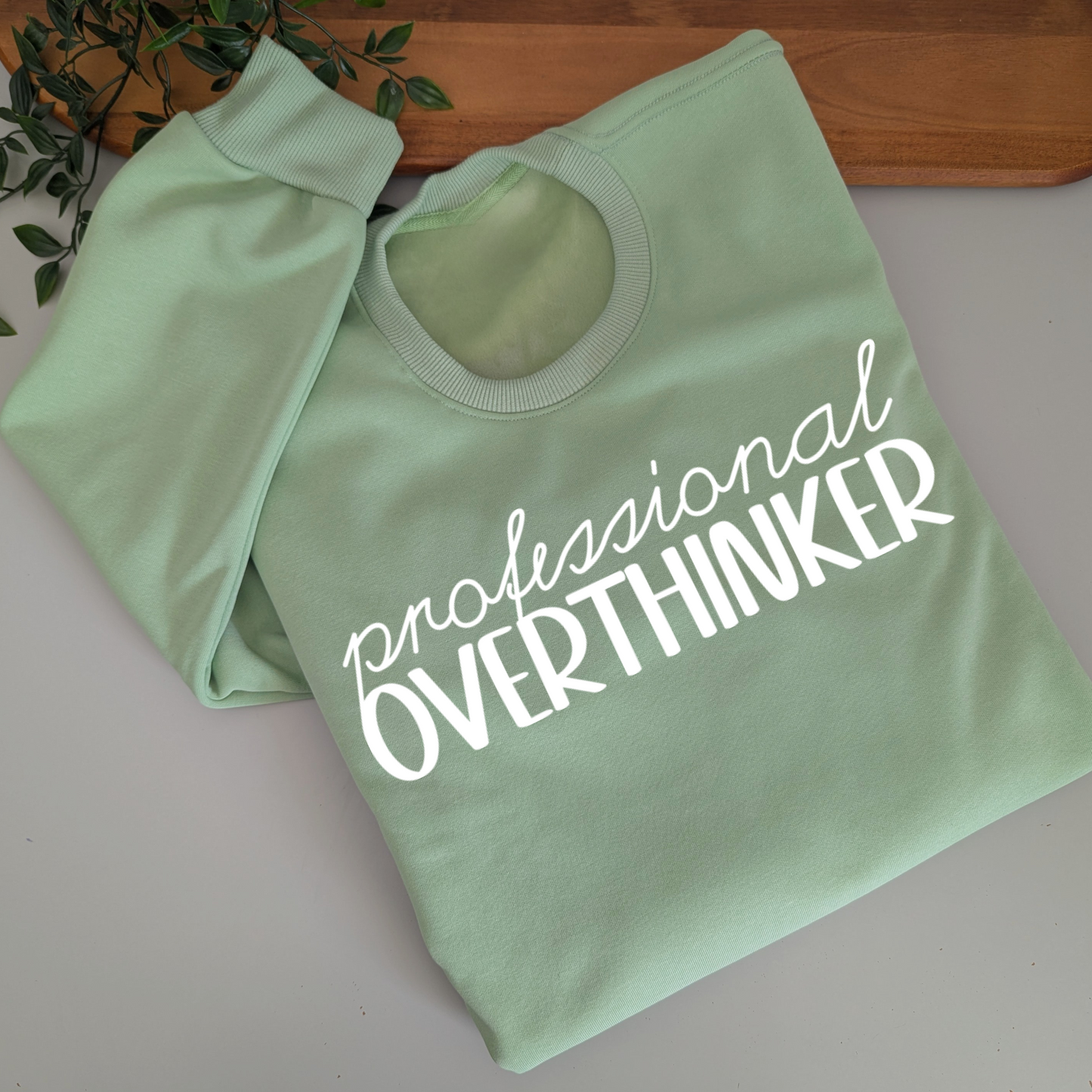 Professional Overthinker womens crewneck jumper. Indigo blue fleece jumper with white decal
