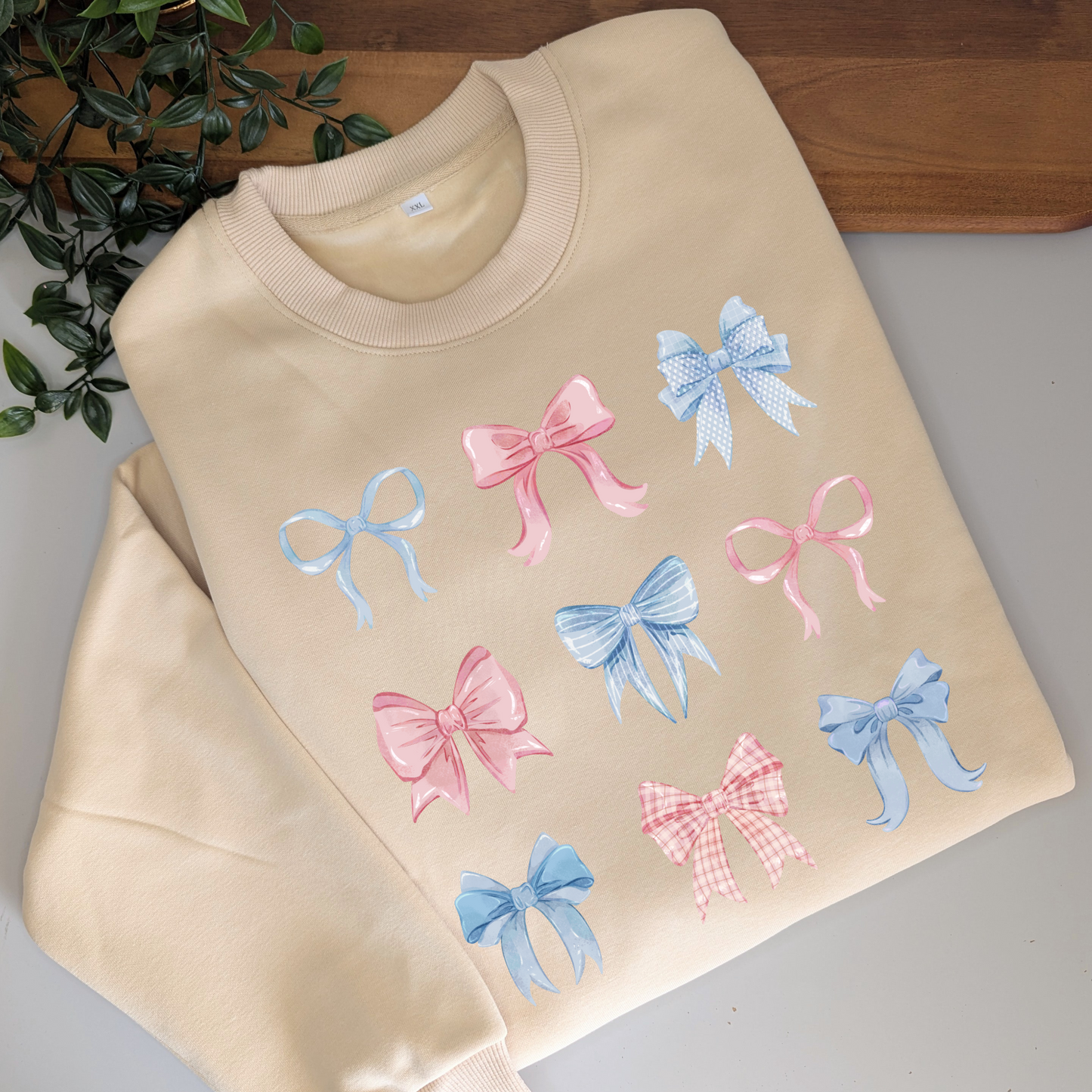 Pastel watercolour bows cute fleece women's jumper. Soft fleece want jumper. Denim Blue or cream jumper. Girly bows.