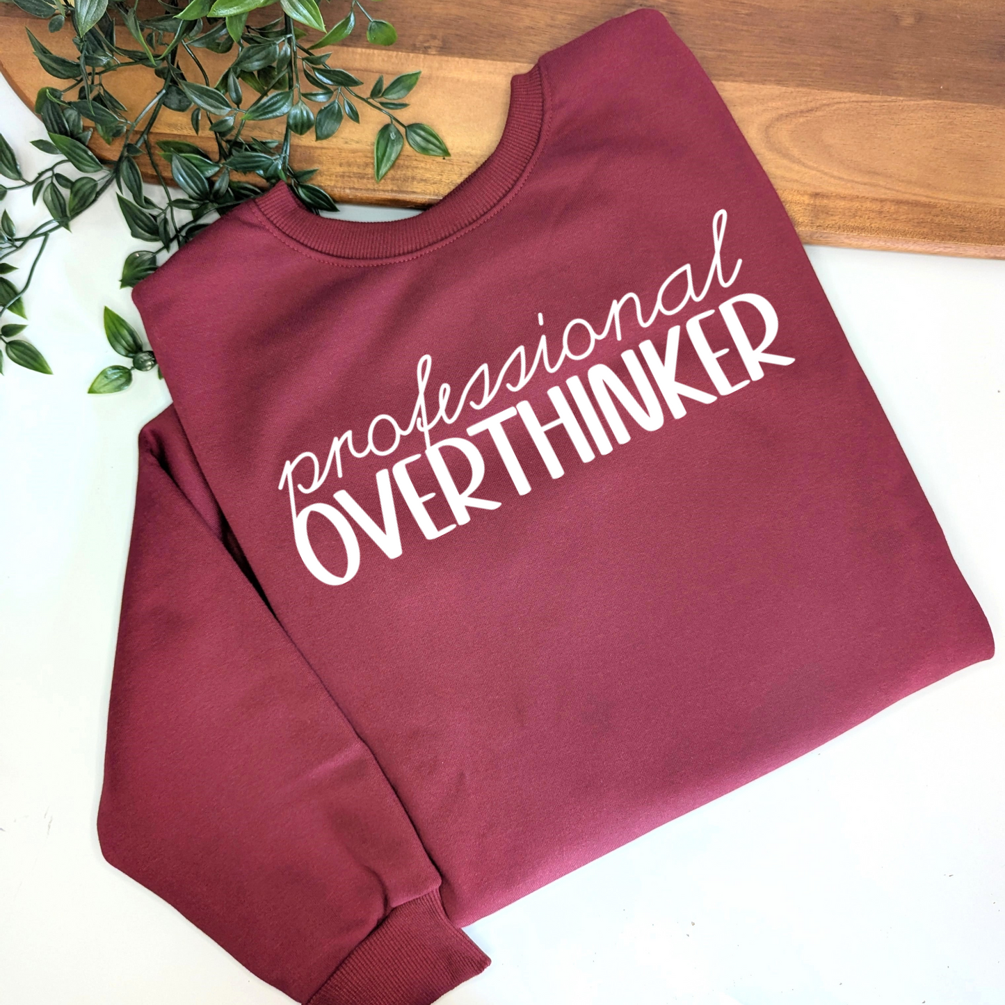 Professional Overthinker womens crewneck jumper. Indigo blue fleece jumper with white decal