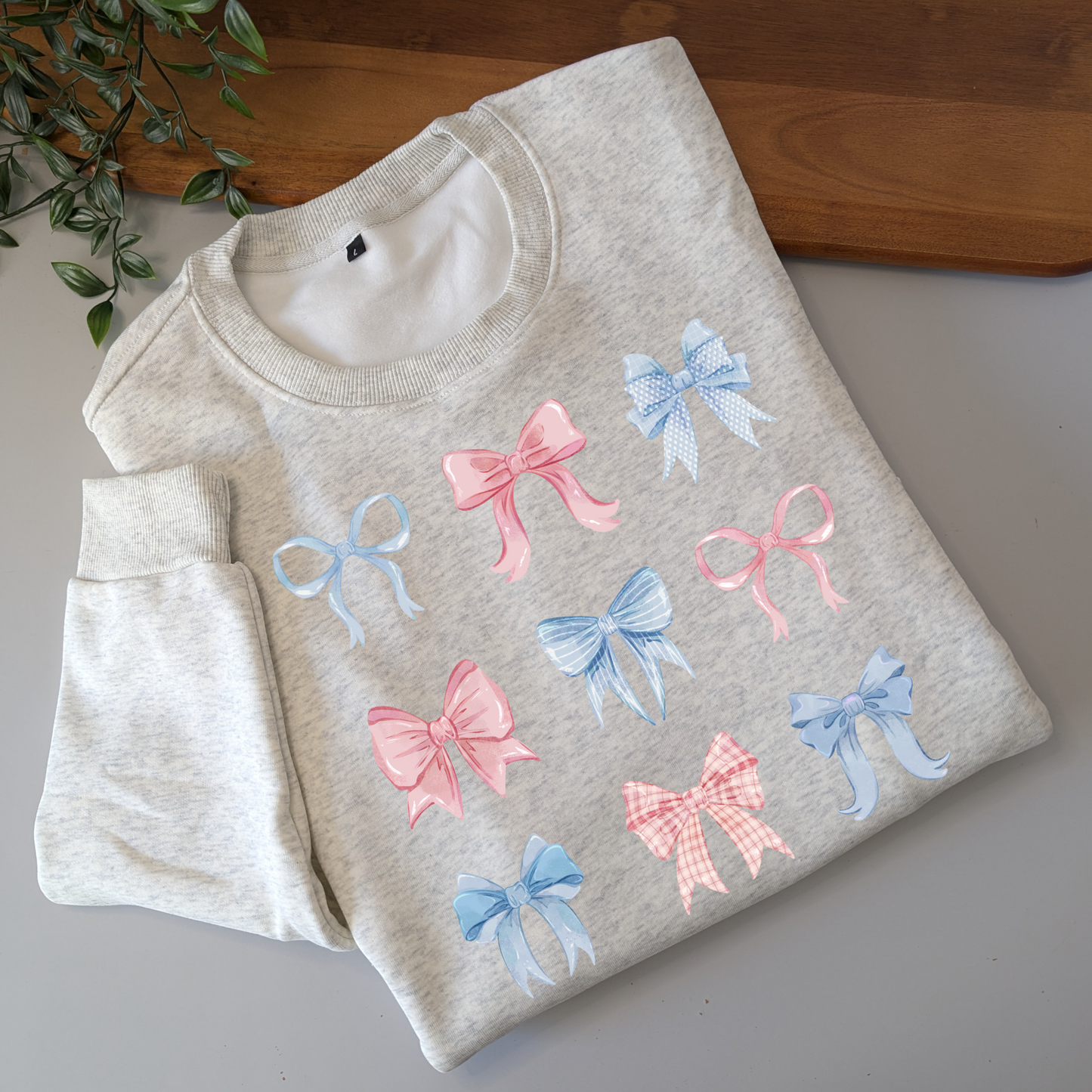 Pastel watercolour bows cute fleece women's jumper. Soft fleece want jumper. Denim Blue or cream jumper. Girly bows.