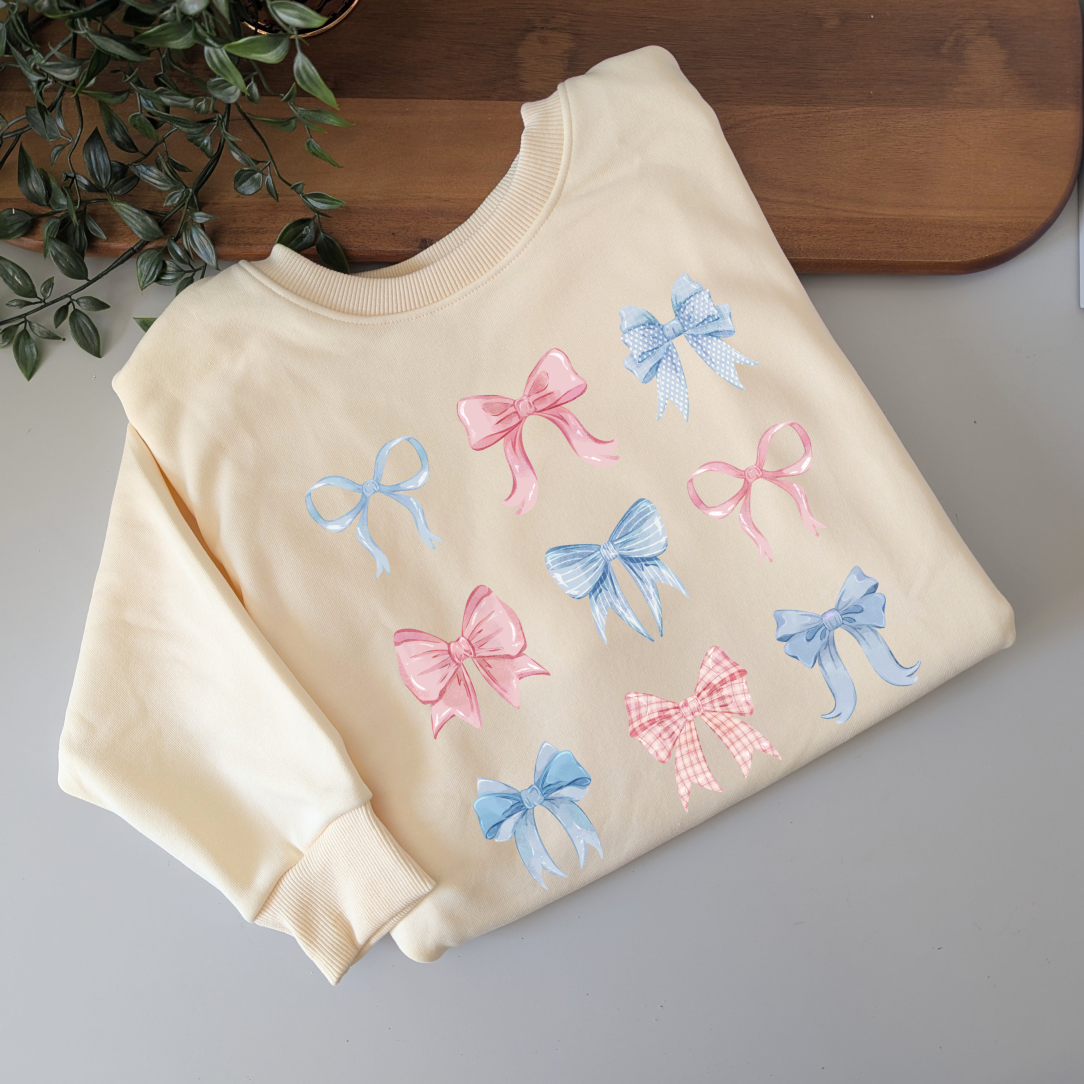 Pastel watercolour bows cute fleece women's jumper. Soft fleece want jumper. Denim Blue or cream jumper. Girly bows.