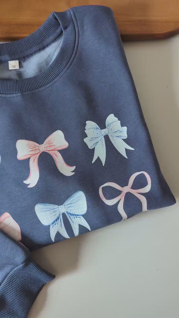 Pastel multi bows cute fleece women's jumper. Soft fleece want jumper. Denim Blue or cream jumper. Girly bows.